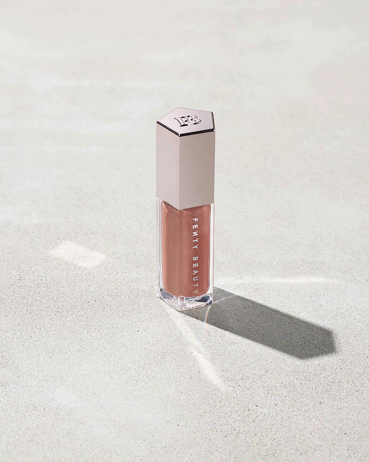 FENTY BEAUTY BY RIHANNA GLOSSBOMB UNIVERSAL LIP LUMINIZER (FENTY GLOW 01)