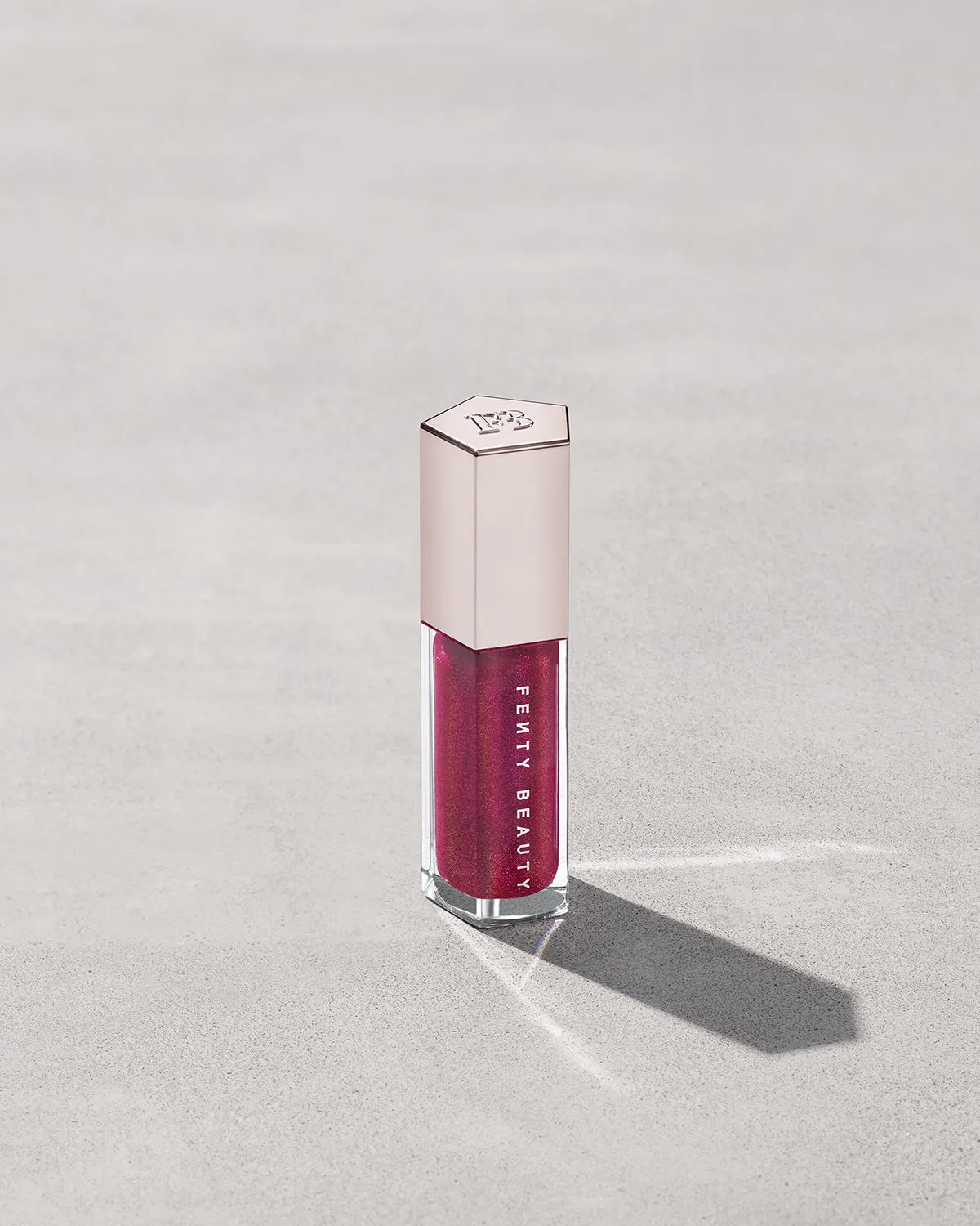 FENTY BEAUTY BY RIHANNA GLOSSBOMB UNIVERSAL LIP LUMINIZER (FUSHIA FLEX)