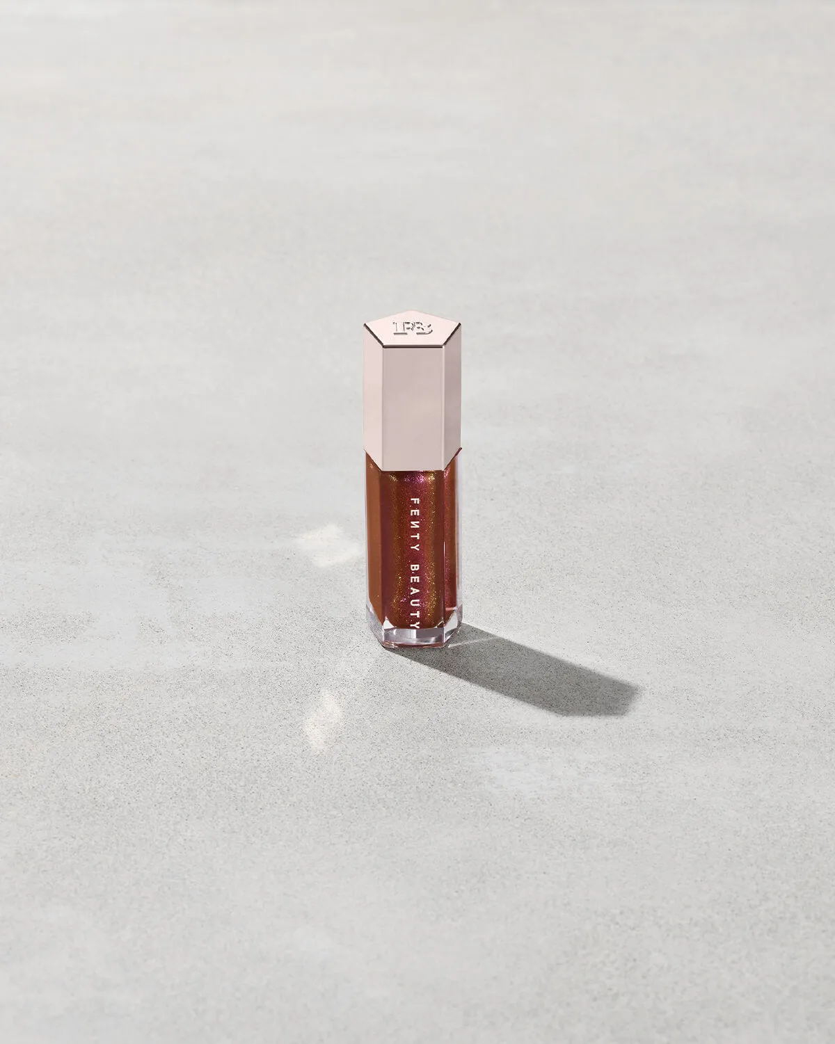 FENTY BEAUTY BY RIHANNA GLOSSBOMB UNIVERSAL LIP LUMINIZER (HOT COCOLIT FANTASY 09)